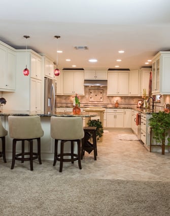 This remodel from DreamMaker of Bakersfield demonstrates one of the biggest trends in kitchen remodeling — opening the kitchen up to the rest of the living space.