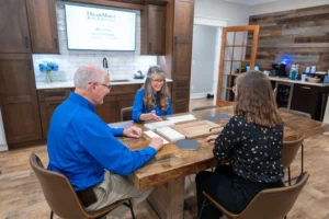 DreamMaker franchisee holding a Design Center consultation with client